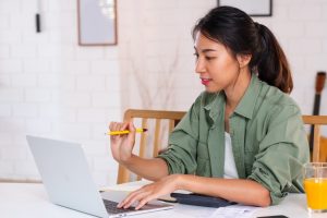 Woman comparing personal loan differences between banks and money lenders