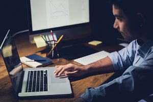 Man researching and choosing reliable licensed money lender in Singapore