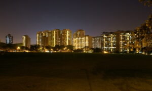 A wide, night shot of Clementi’s stretch of high-rise apartments