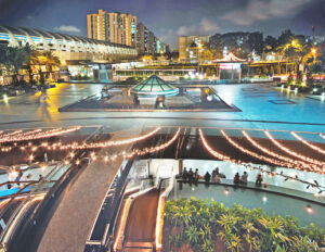 Well-lit Kallang-Paya Lebar Expressway and National Stadium during evening time