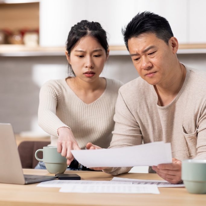 Couple worried about finances, trying to differentiate illegal money lenders in Singapore from licensed money lenders as they contemplate getting a loan