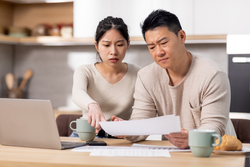 Couple worried about finances, trying to differentiate illegal money lenders in Singapore from licensed money lenders as they contemplate getting a loan