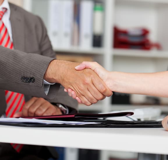 Money lender and Consumer shaking hands after getting loan in Singapore.