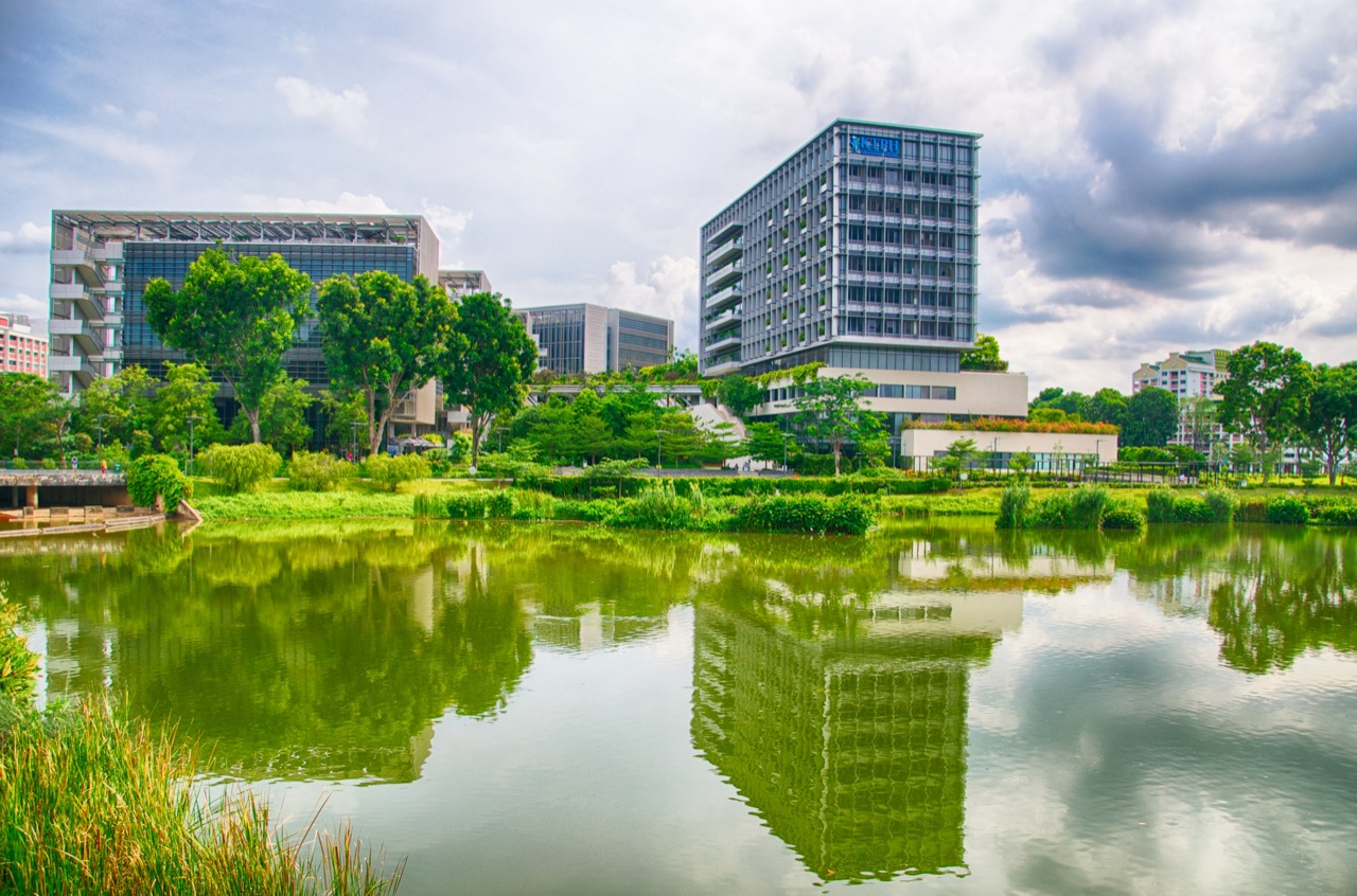 A landscape shot of Khoo Teck Puat Hospital and the tranquil waters and greenery surrounding it