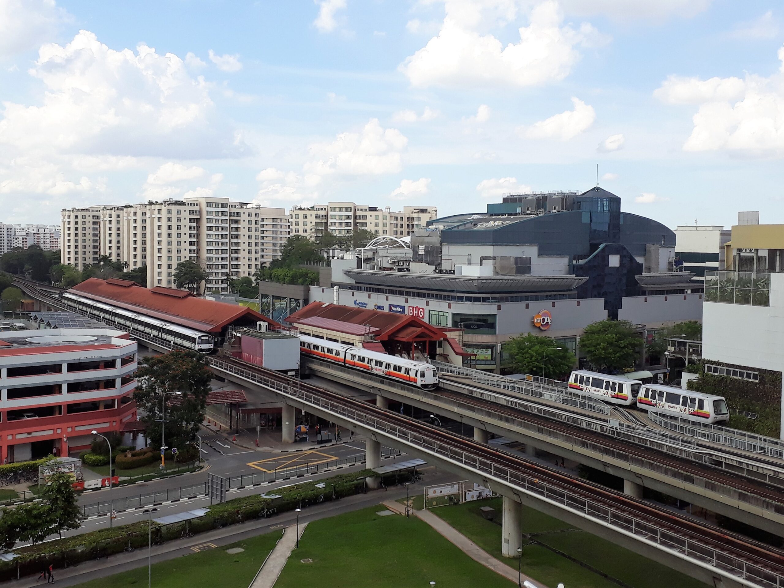 A shot of Choa Chu Kang’s exterior, featuring its MRT tracks, Lot One shopping mall, and buildings within the vicinity