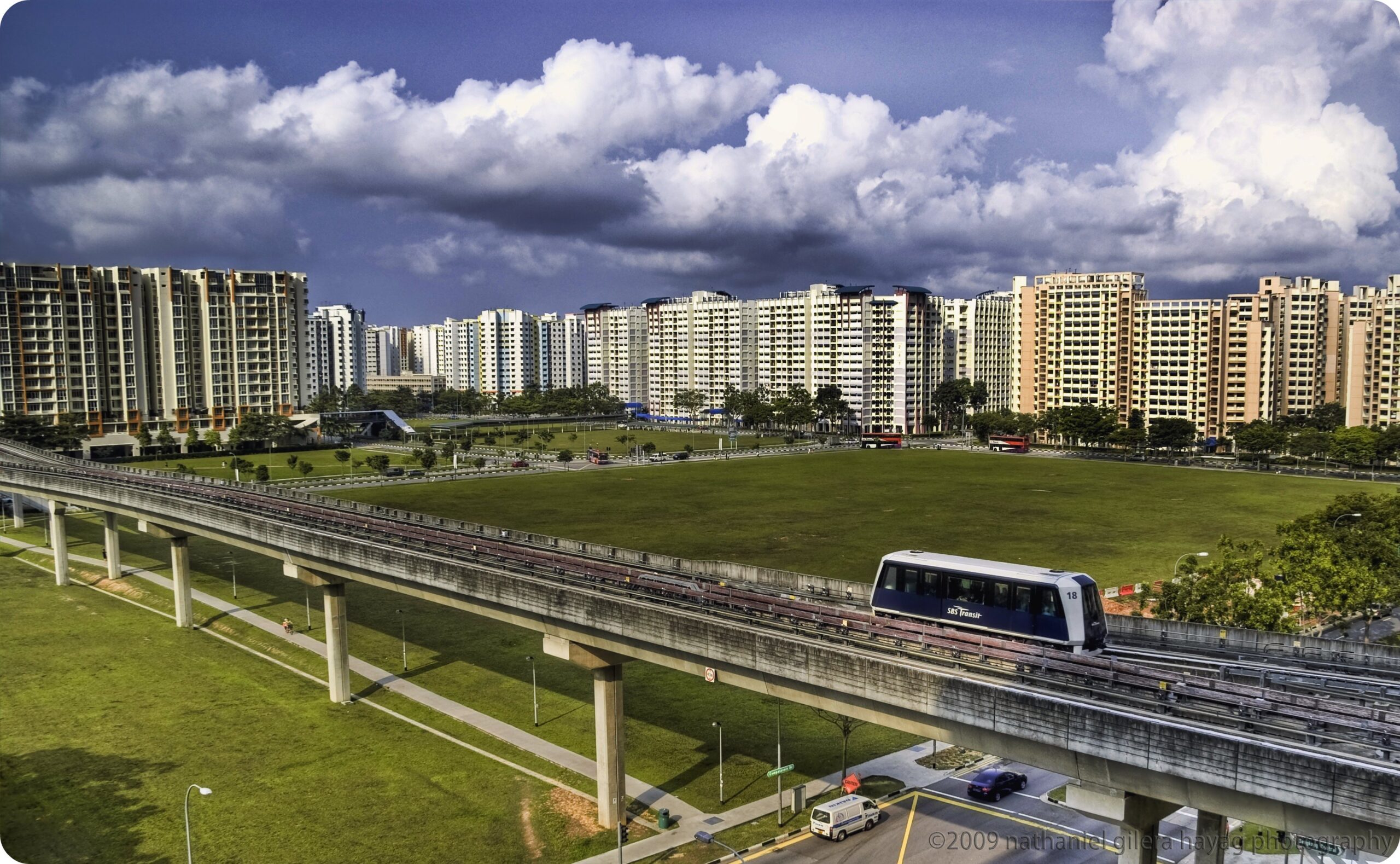 A snapshot of the Sengkang LRT and tracks by a large patch of grass