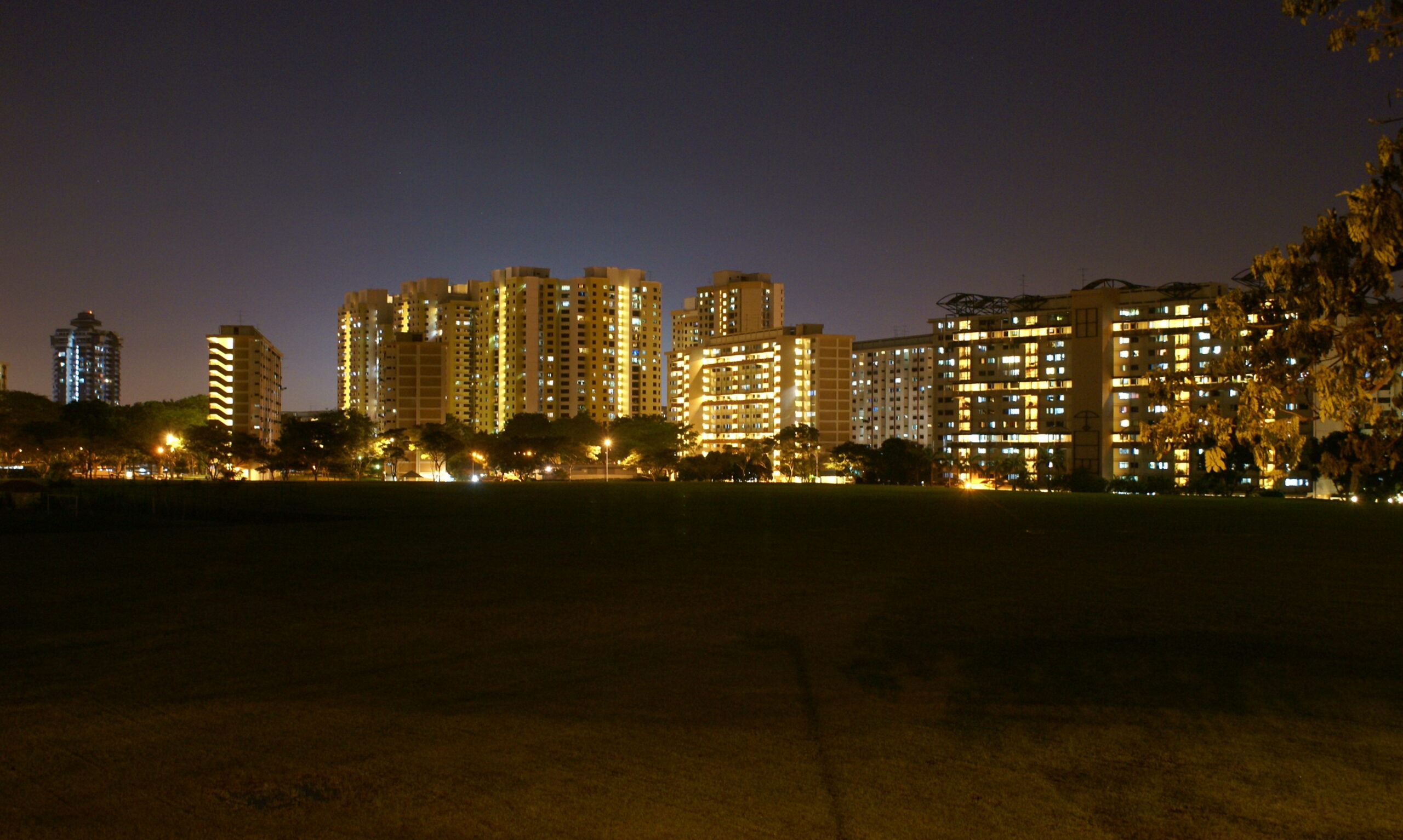 A wide, night shot of Clementi’s stretch of high-rise apartments