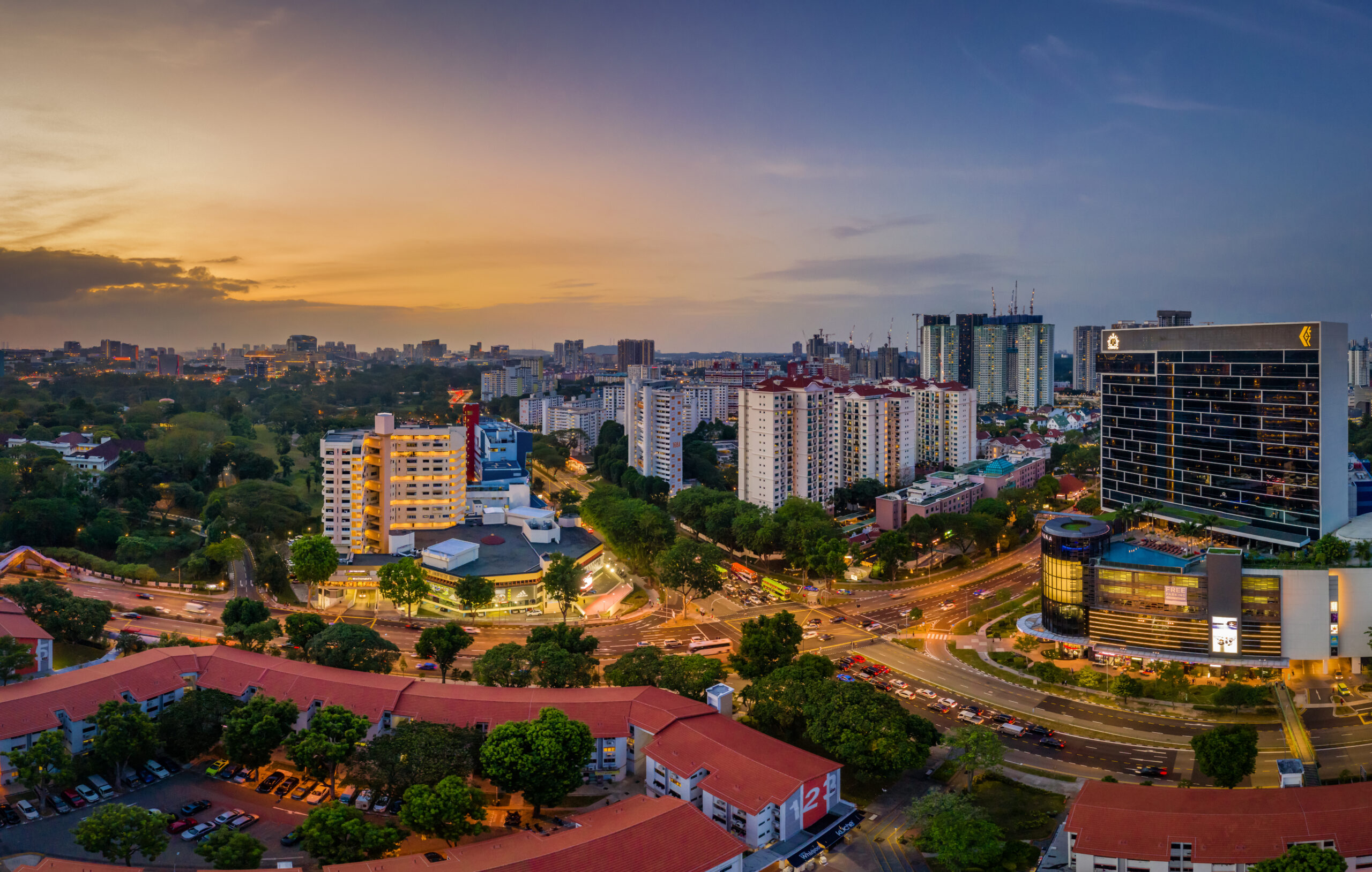 A wide shot of the lively Bukit Merah precinct in the evening