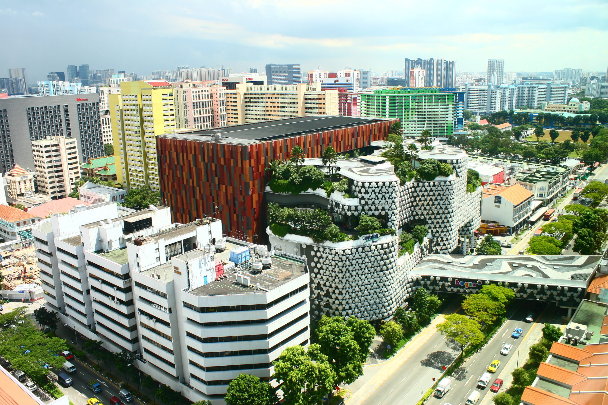 Aerial view of a shopping mall, busy roads, buildings and HDBs in Bugis